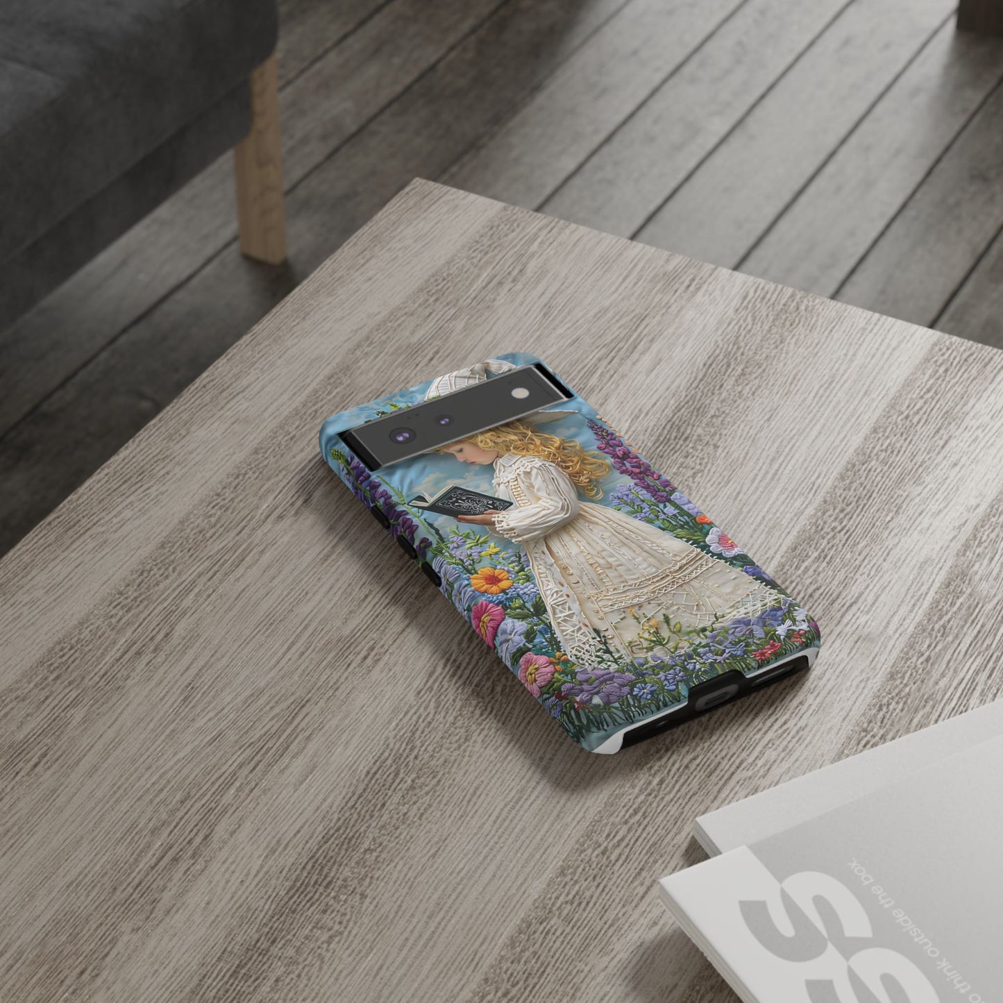 Whimsical Embroidery Of A Girl Reading In A Garden phone case design.