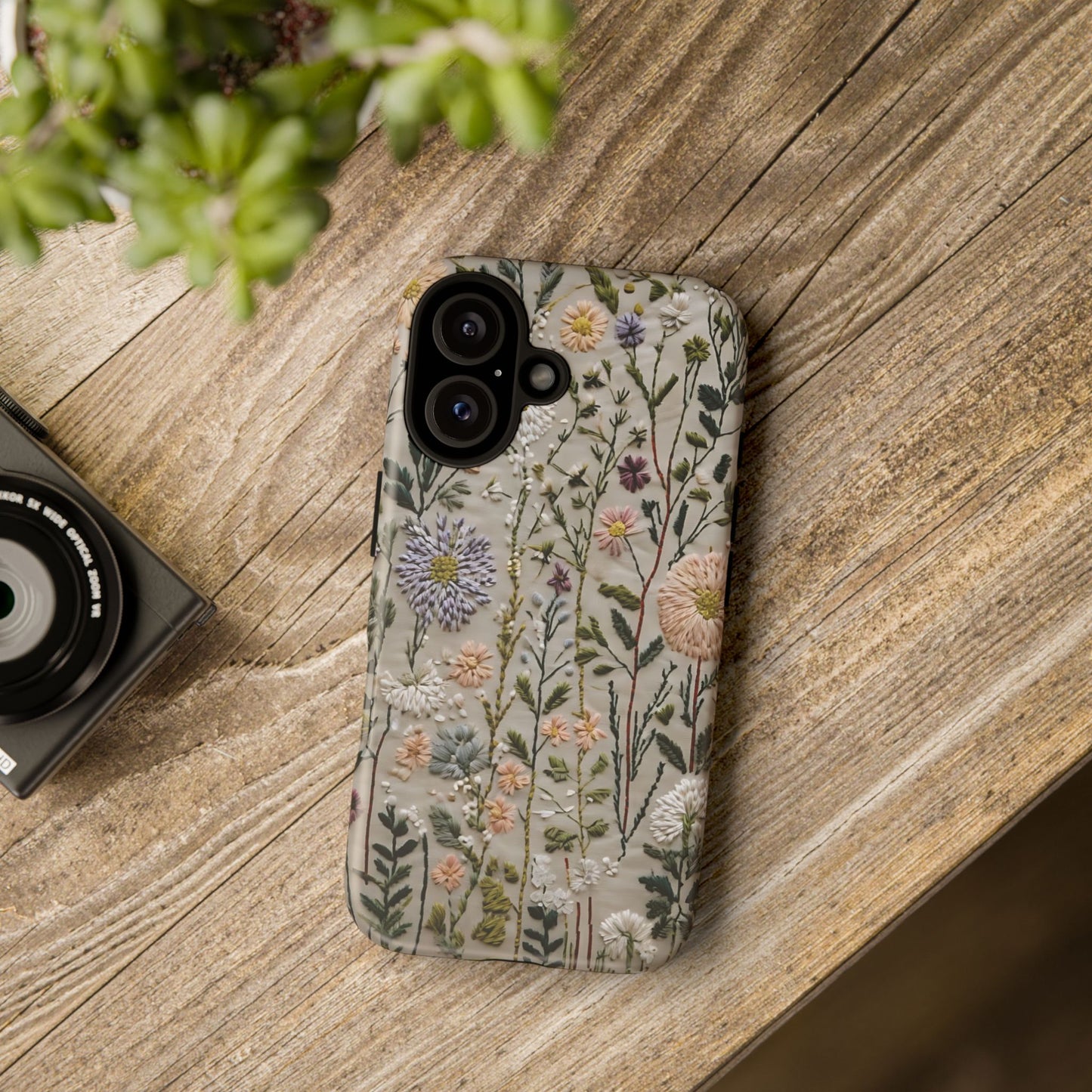 Intricate Embroidery Artwork Featuring Botanical Elements On Beige phone case design.