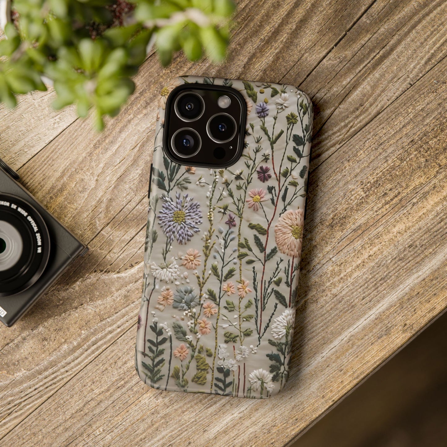 Intricate Embroidery Artwork Featuring Botanical Elements On Beige phone case design.
