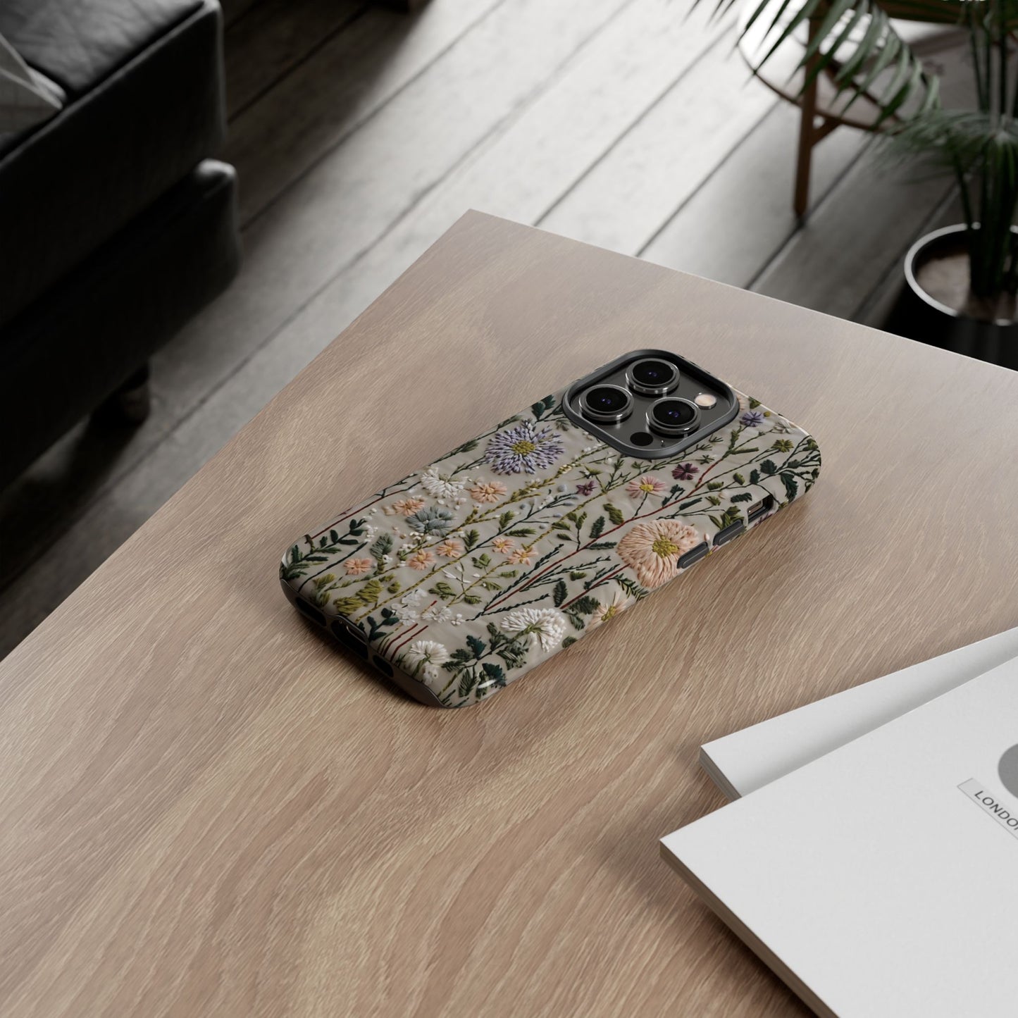 Intricate Embroidery Artwork Featuring Botanical Elements On Beige phone case design.