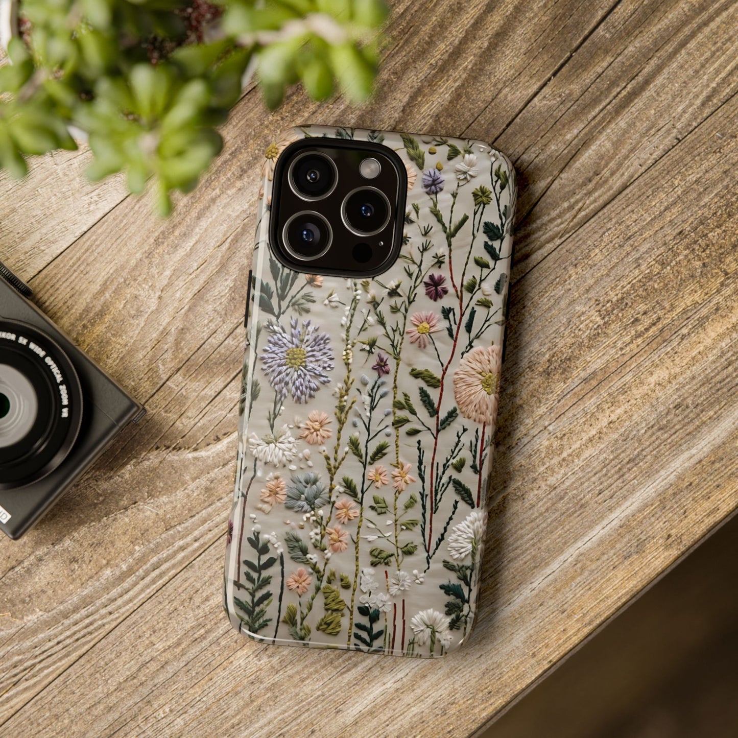 Intricate Embroidery Artwork Featuring Botanical Elements On Beige phone case design.