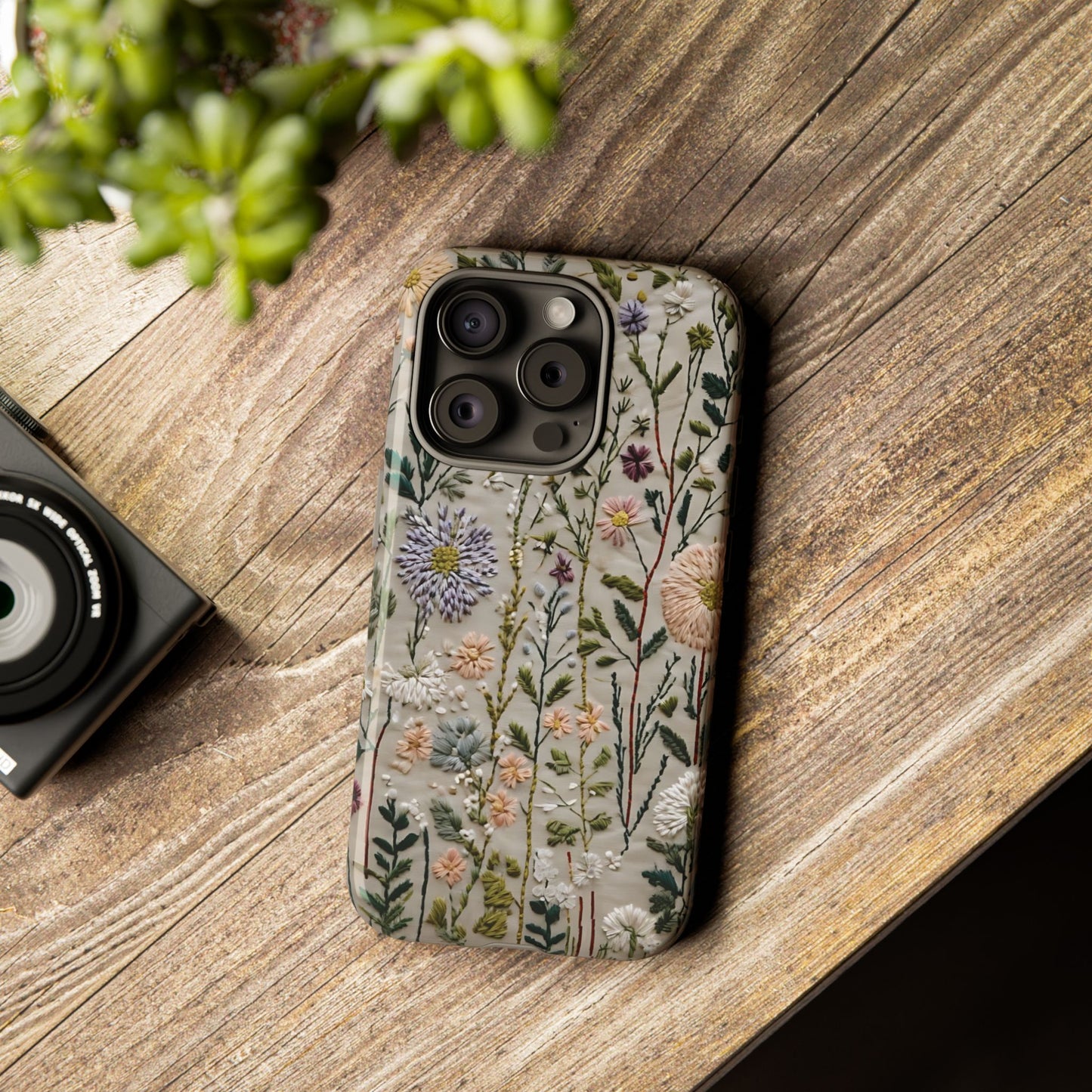 Intricate Embroidery Artwork Featuring Botanical Elements On Beige phone case design.
