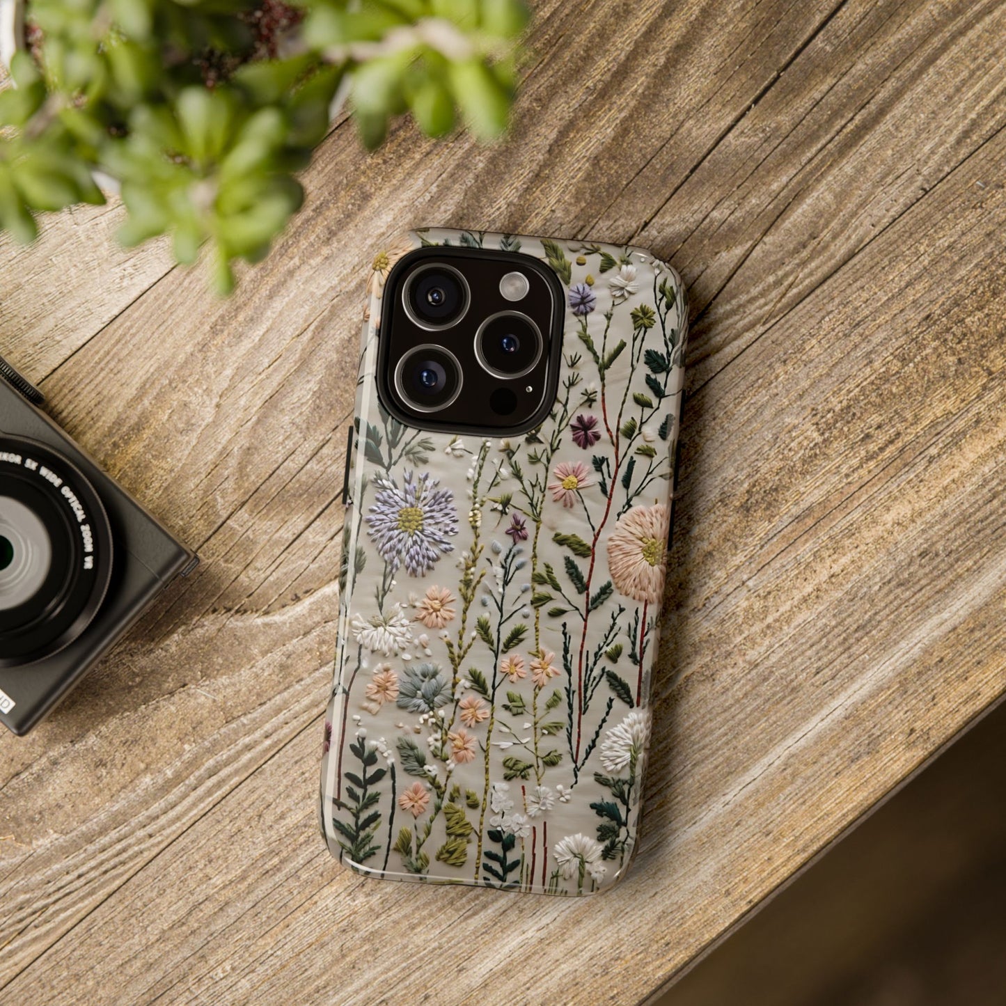Intricate Embroidery Artwork Featuring Botanical Elements On Beige phone case design.