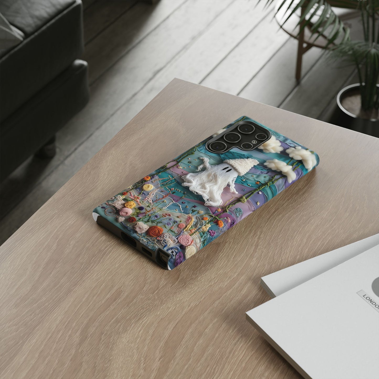 Whimsical Ghost Surrounded By Vibrant Embroidered Flowers phone case design.