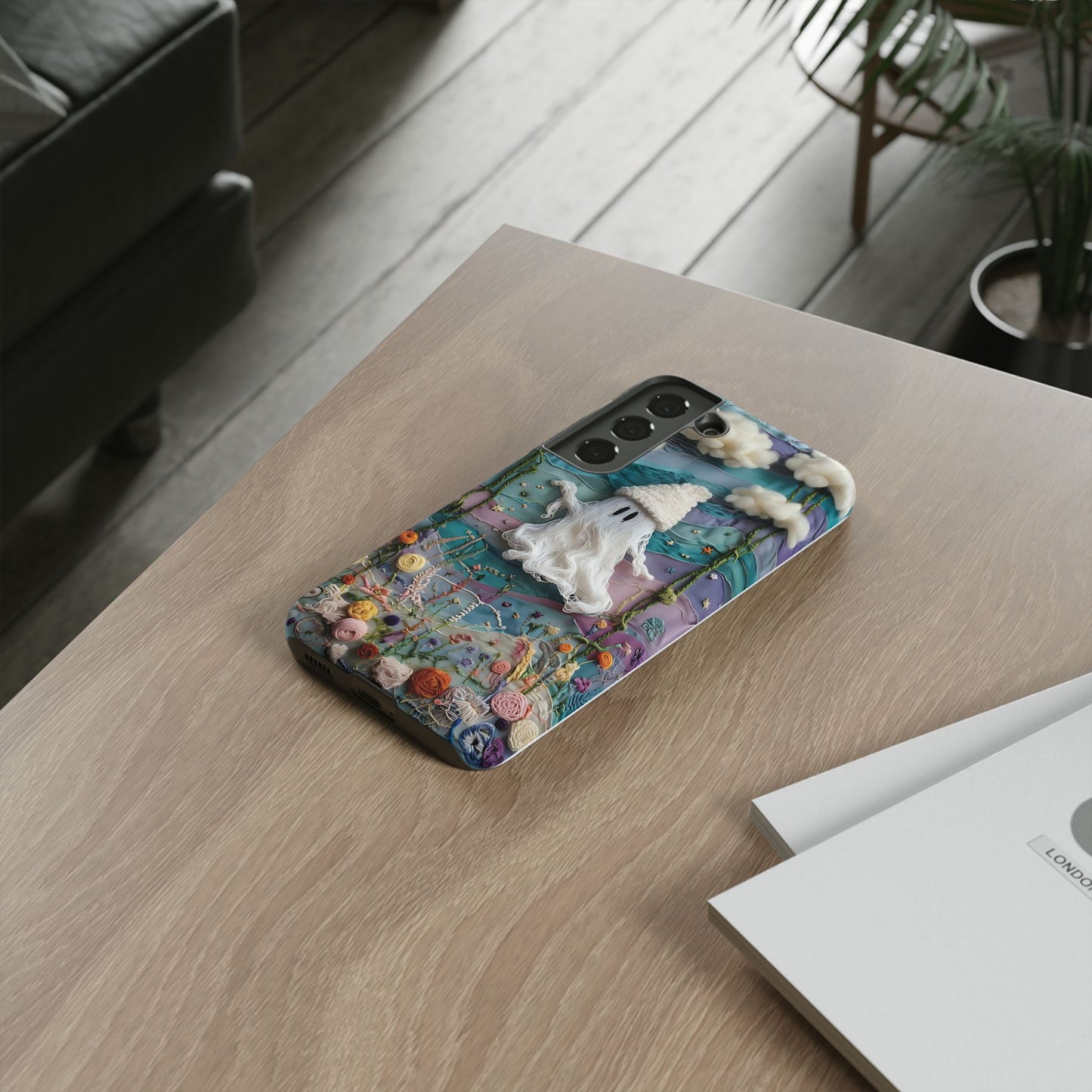Whimsical Ghost Surrounded By Vibrant Embroidered Flowers phone case design.