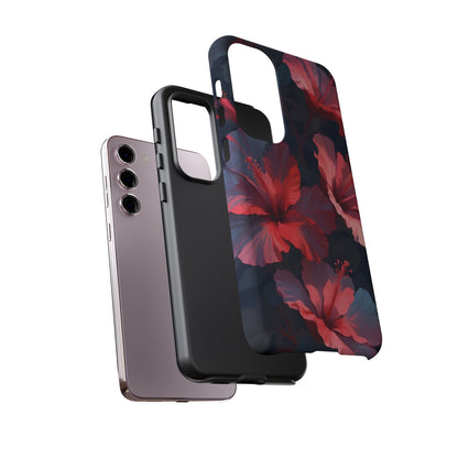 Vibrant red and pink hibiscus flowers blooming against a dark background| Floral phone case design