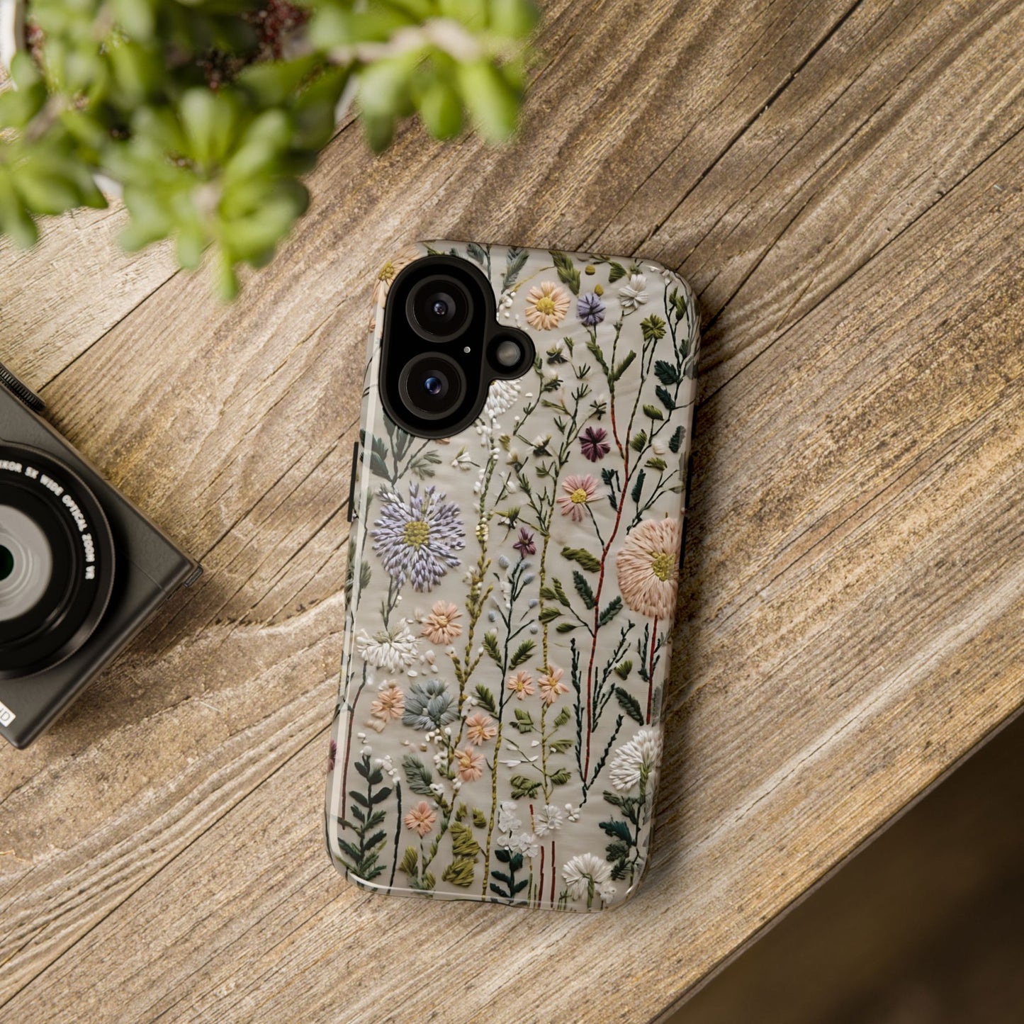 Intricate Embroidery Artwork Featuring Botanical Elements On Beige phone case design.