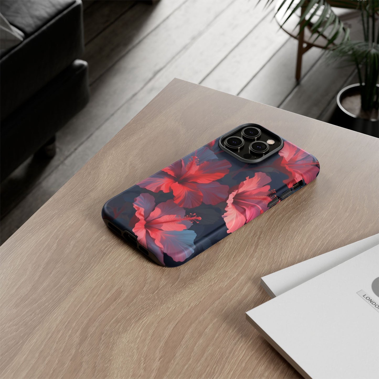 Vibrant red and pink hibiscus flowers blooming against a dark background| Floral phone case design