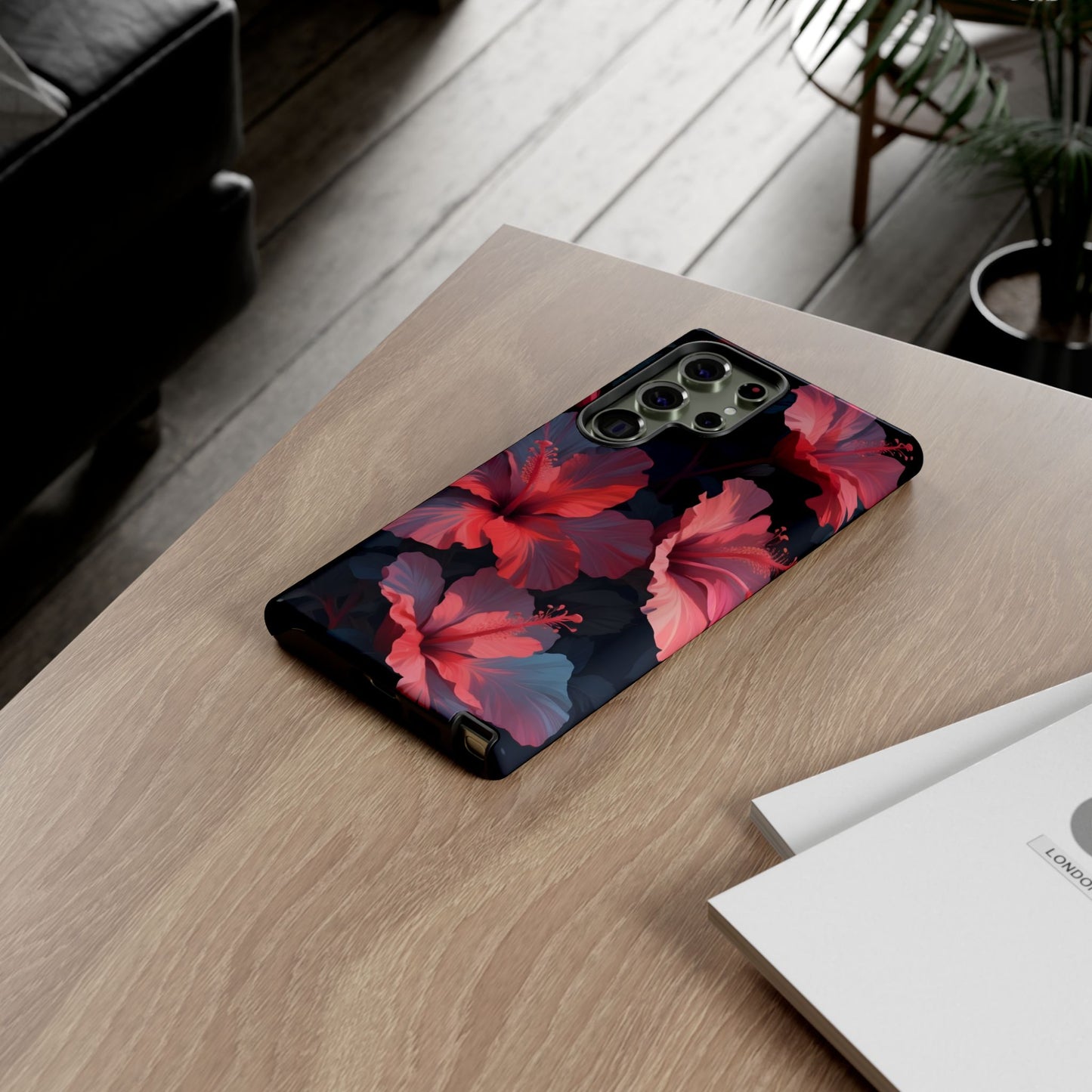 Vibrant red and pink hibiscus flowers blooming against a dark background| Floral phone case design