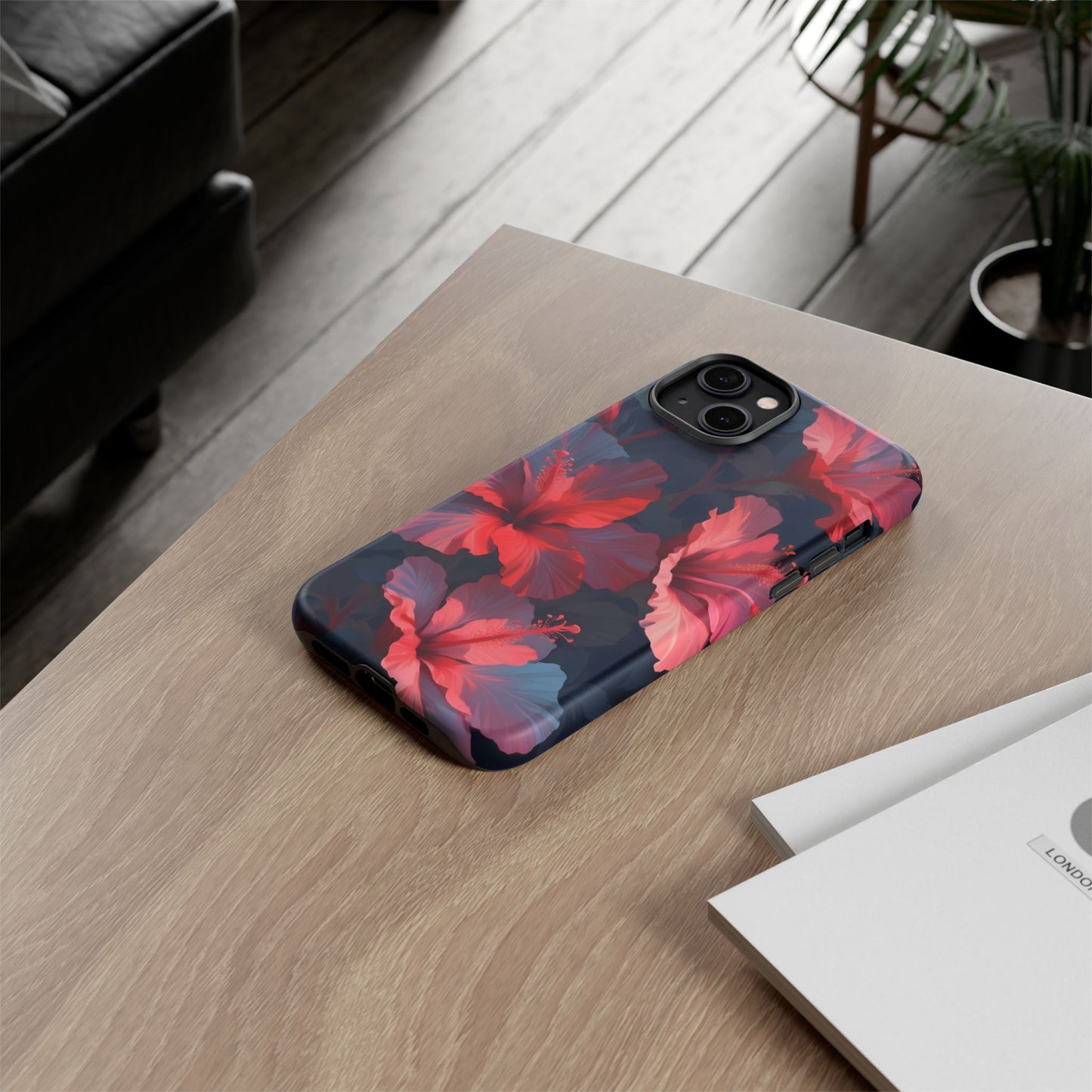 Vibrant red and pink hibiscus flowers blooming against a dark background| Floral phone case design