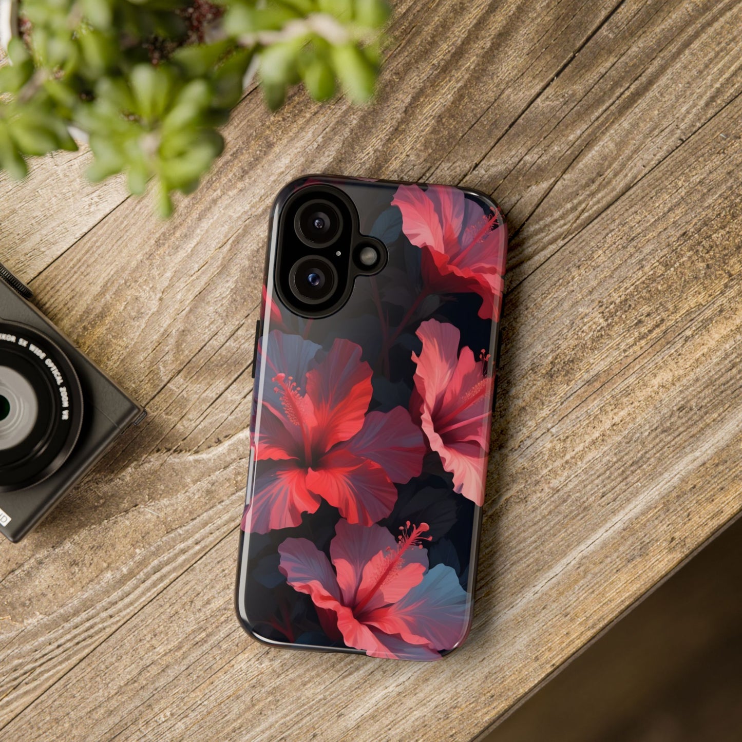 Vibrant red and pink hibiscus flowers blooming against a dark background| Floral phone case design