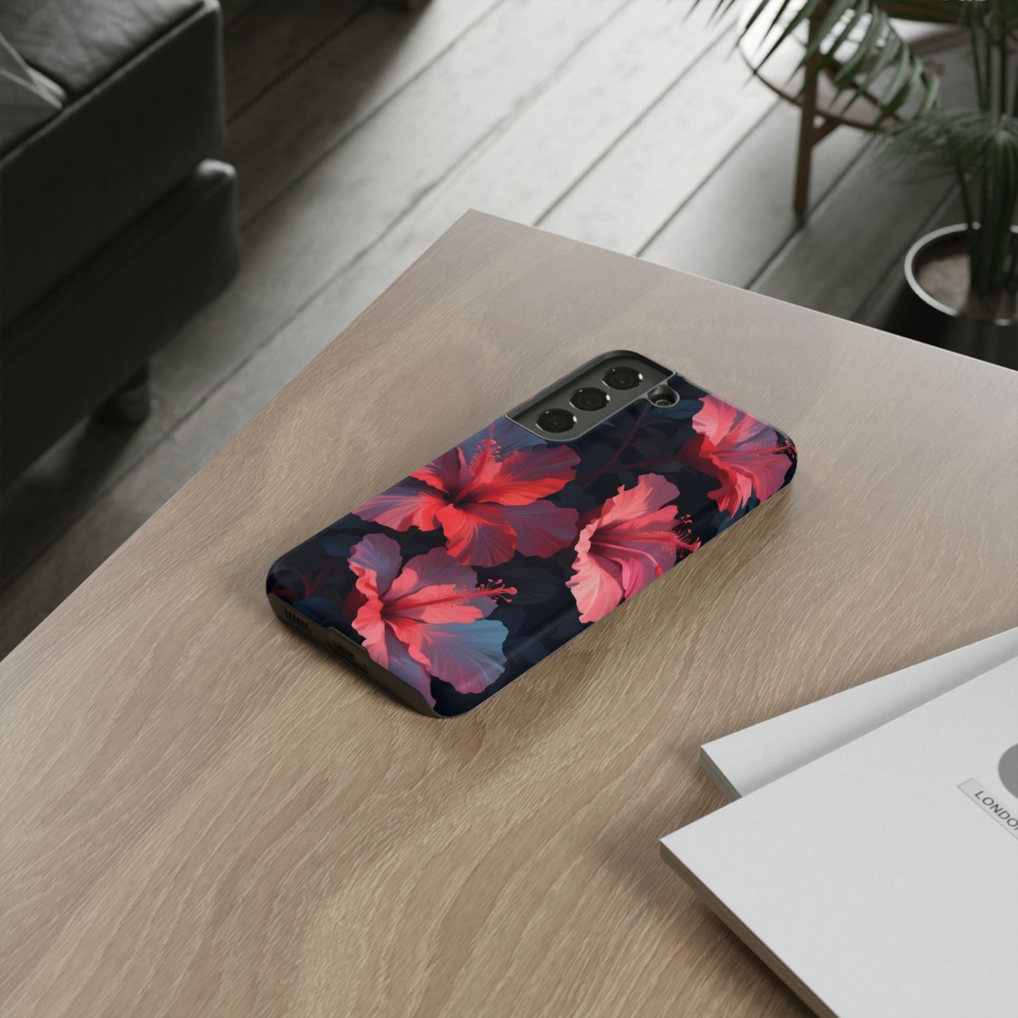 Vibrant red and pink hibiscus flowers blooming against a dark background| Floral phone case design