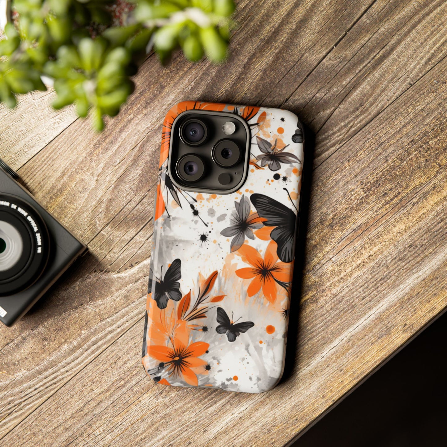 Bold Butterfly & Floral Splash Mobile Cover – Black & Orange Aesthetic
