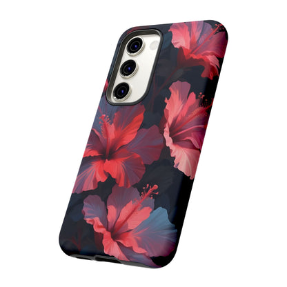 Vibrant red and pink hibiscus flowers blooming against a dark background| Floral phone case design