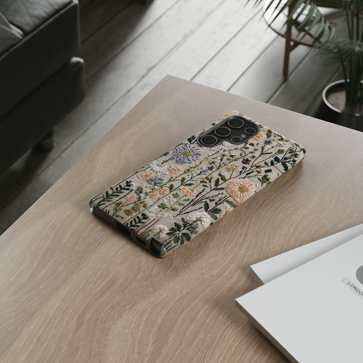 Intricate Embroidery Artwork Featuring Botanical Elements On Beige phone case design.