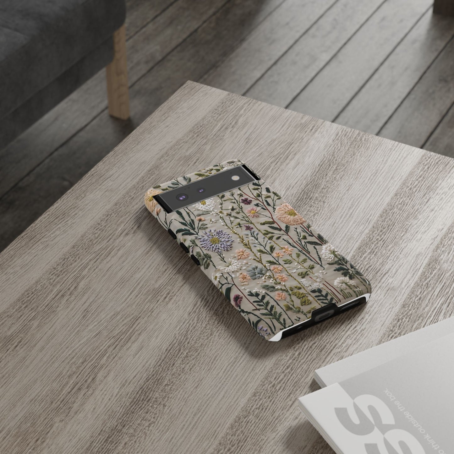Intricate Embroidery Artwork Featuring Botanical Elements On Beige phone case design.