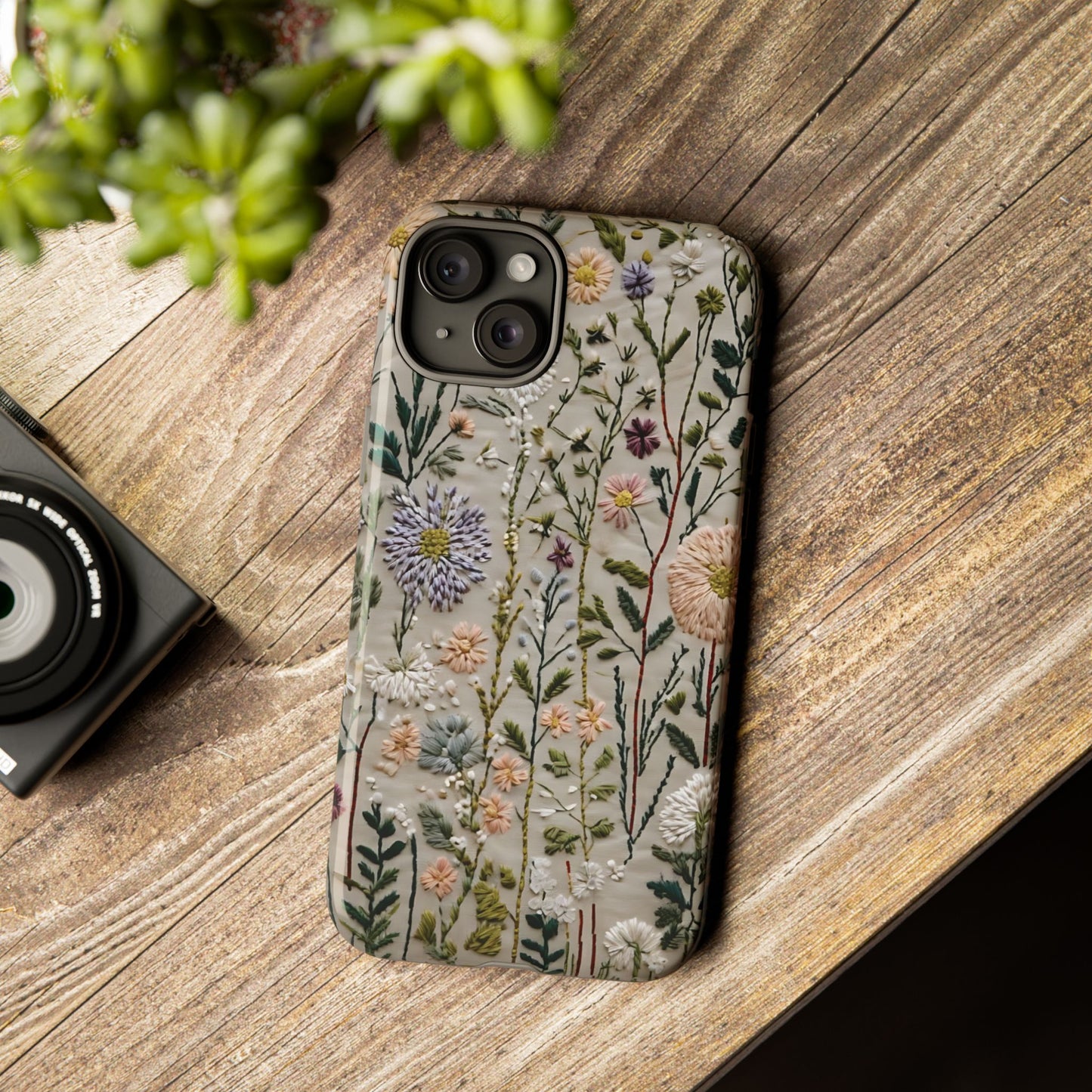 Intricate Embroidery Artwork Featuring Botanical Elements On Beige phone case design.