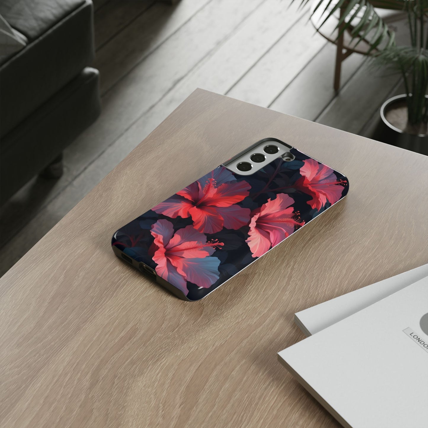 Vibrant red and pink hibiscus flowers blooming against a dark background| Floral phone case design