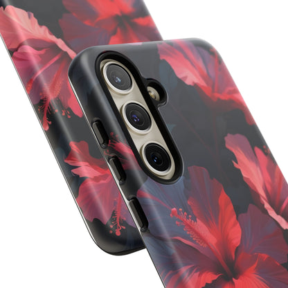 Vibrant red and pink hibiscus flowers blooming against a dark background| Floral phone case design
