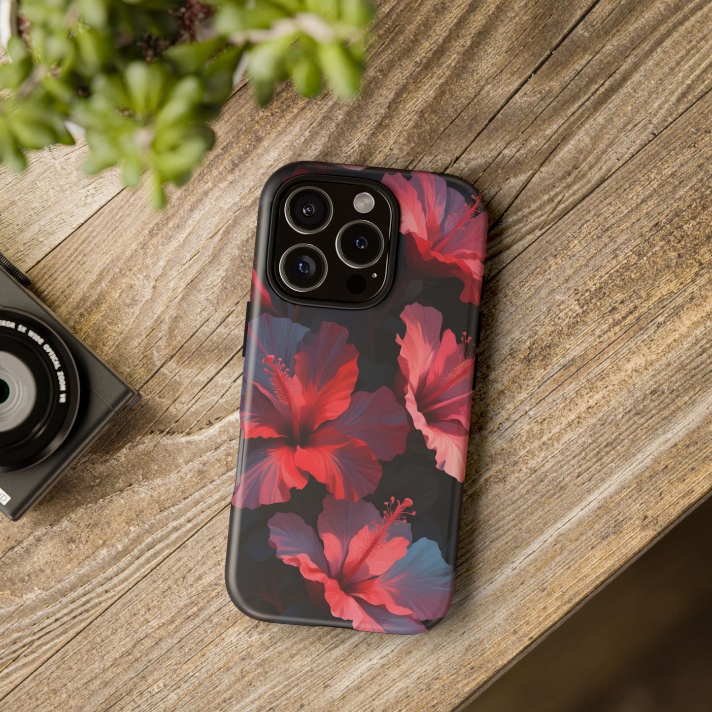 Vibrant red and pink hibiscus flowers blooming against a dark background| Floral phone case design