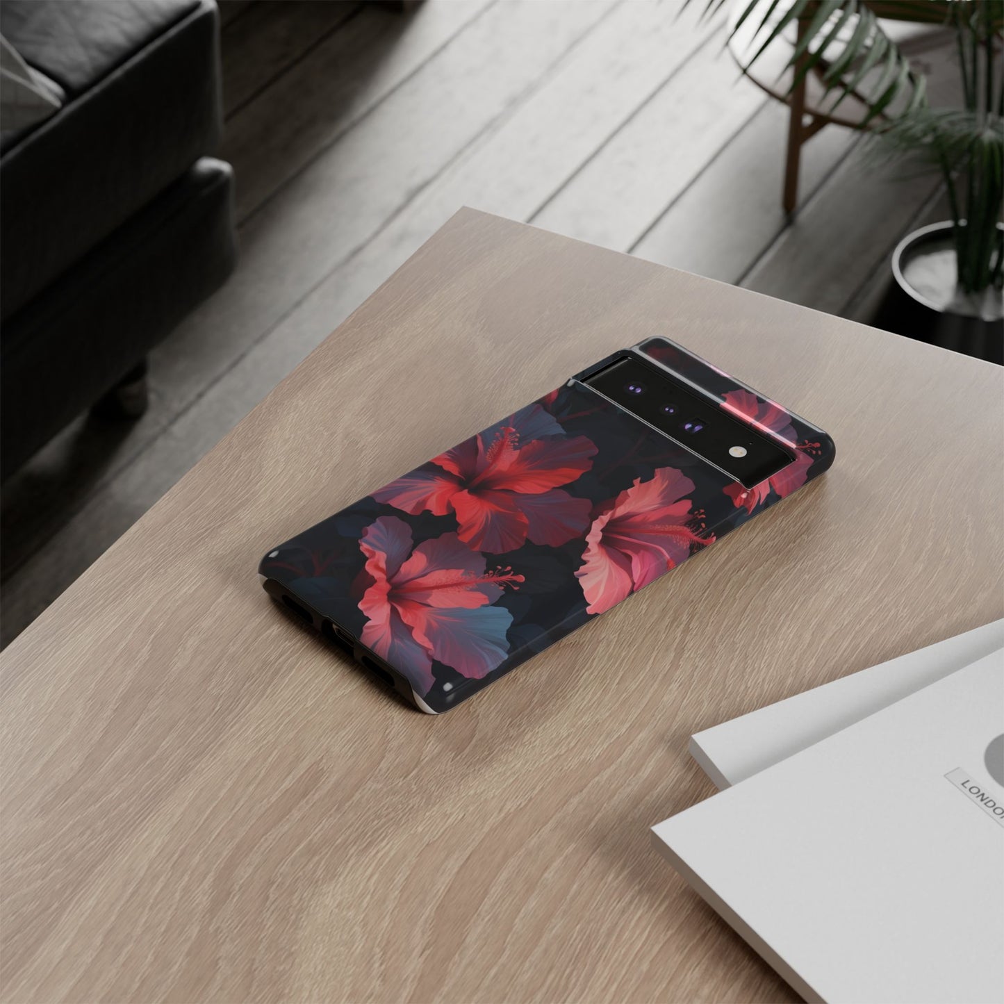 Vibrant red and pink hibiscus flowers blooming against a dark background| Floral phone case design