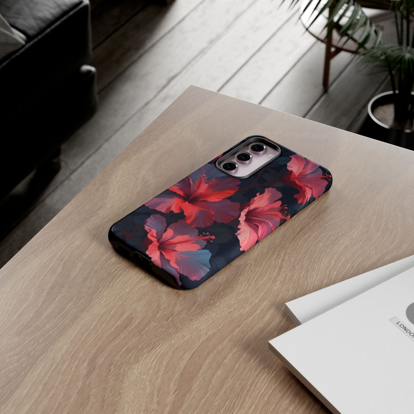 Vibrant red and pink hibiscus flowers blooming against a dark background| Floral phone case design