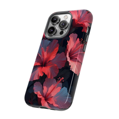 Vibrant red and pink hibiscus flowers blooming against a dark background| Floral phone case design