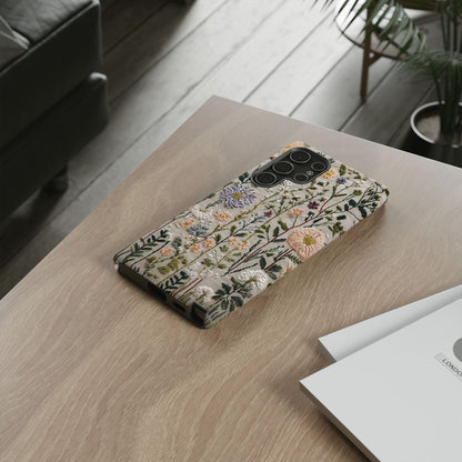 Intricate Embroidery Artwork Featuring Botanical Elements On Beige phone case design.