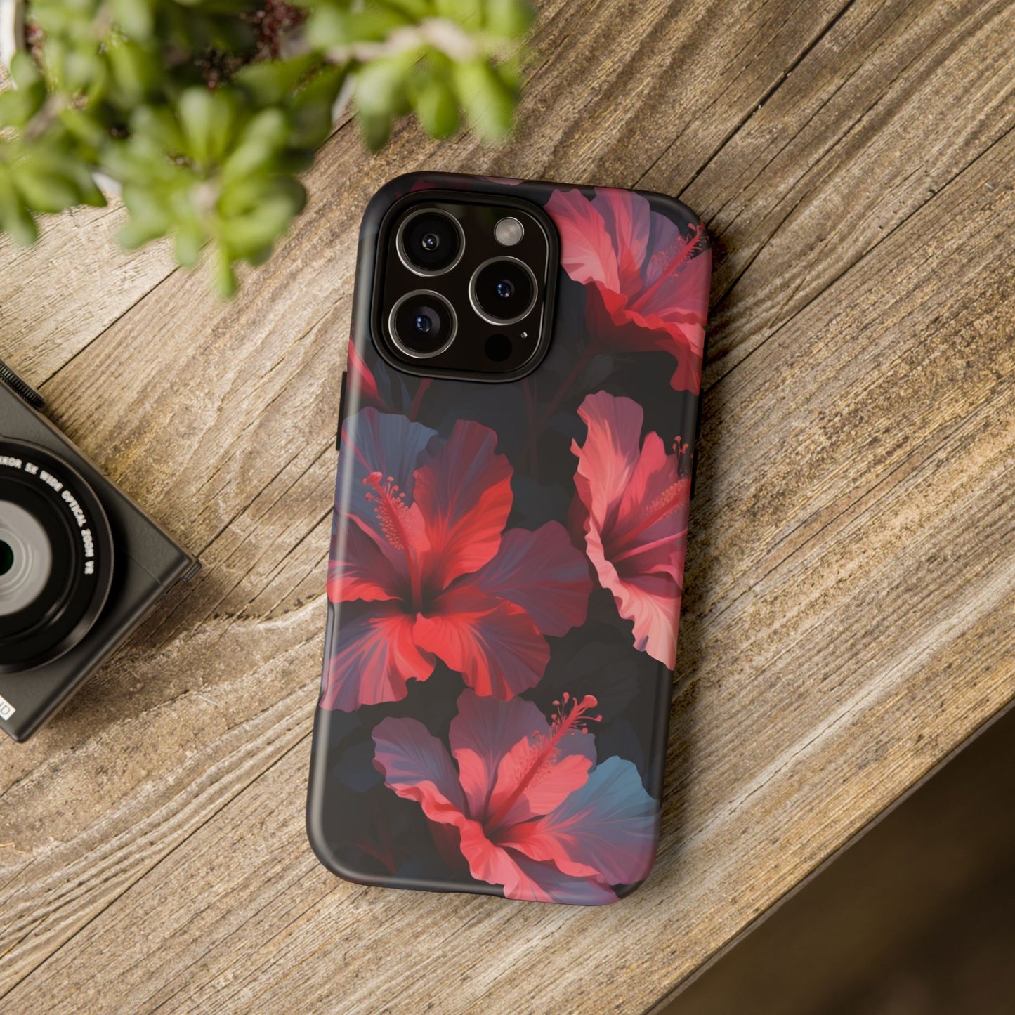 Vibrant red and pink hibiscus flowers blooming against a dark background| Floral phone case design