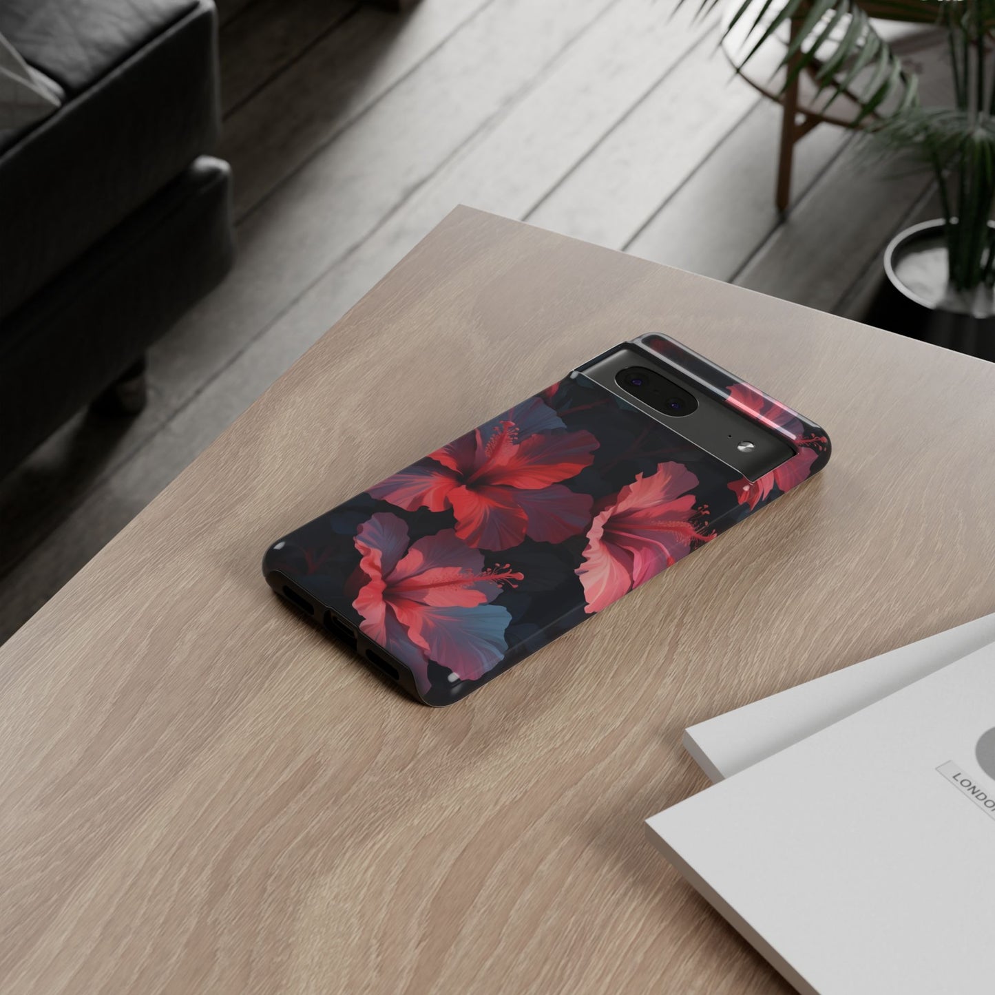 Vibrant red and pink hibiscus flowers blooming against a dark background| Floral phone case design