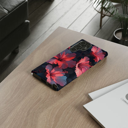 Vibrant red and pink hibiscus flowers blooming against a dark background| Floral phone case design