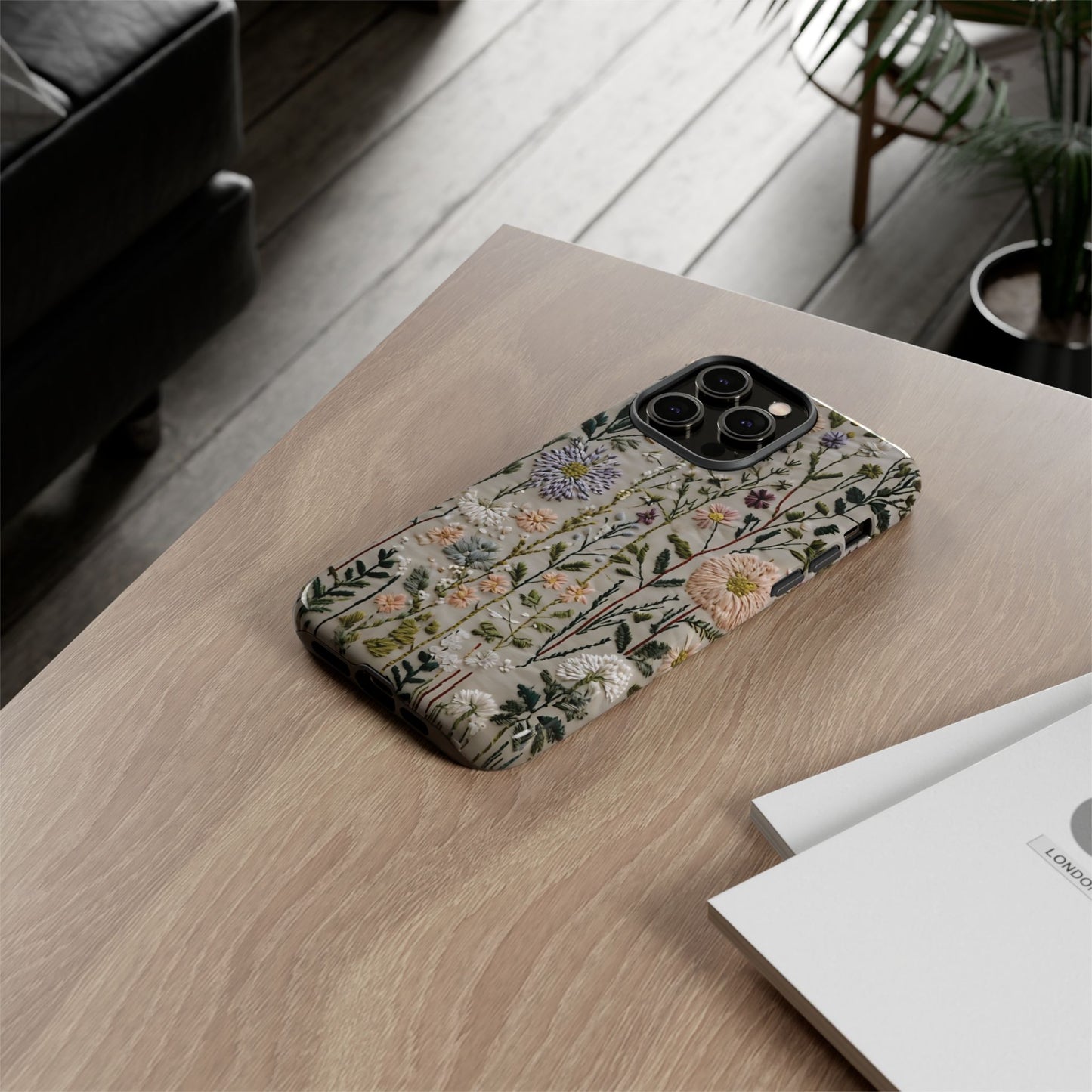 Intricate Embroidery Artwork Featuring Botanical Elements On Beige phone case design.