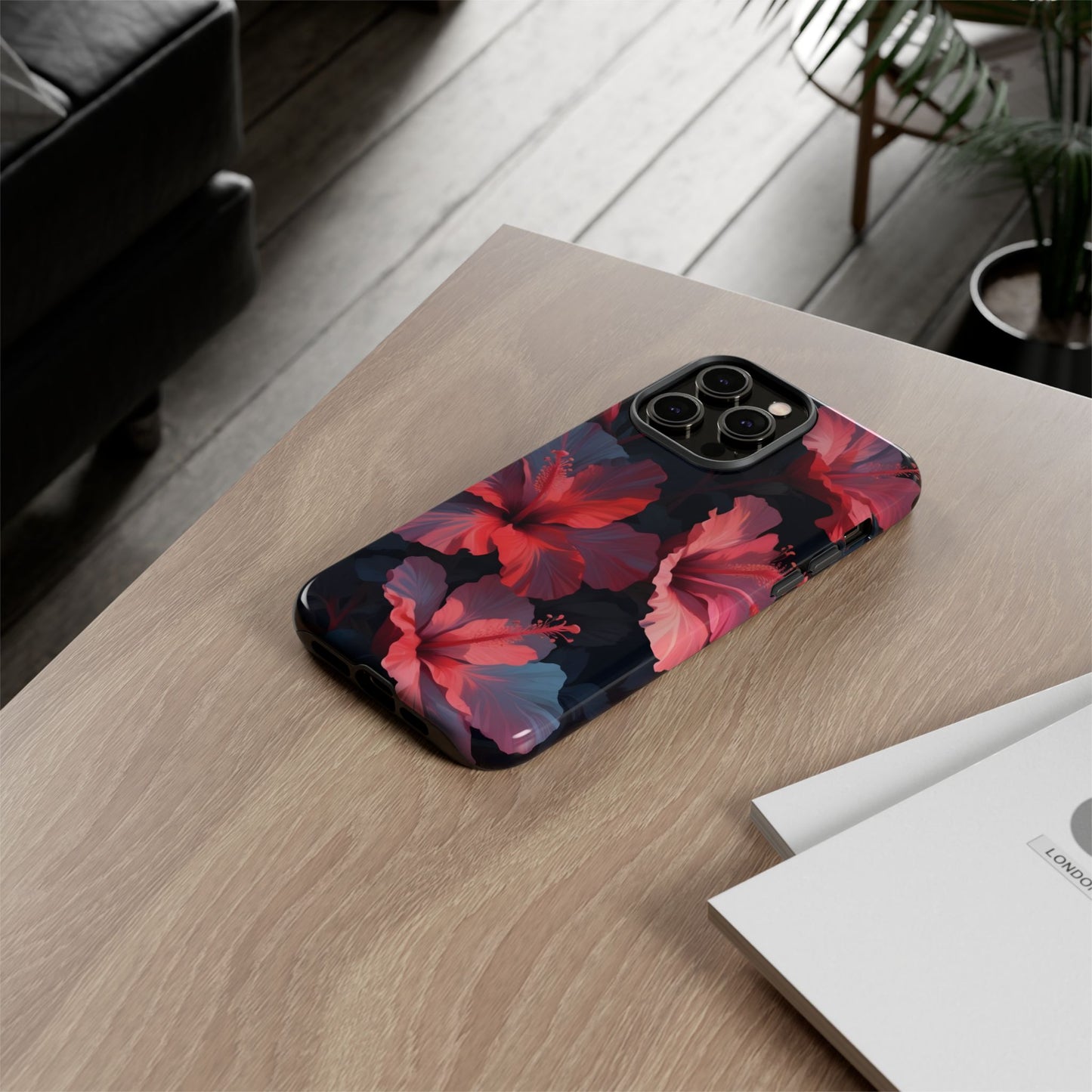 Vibrant red and pink hibiscus flowers blooming against a dark background| Floral phone case design