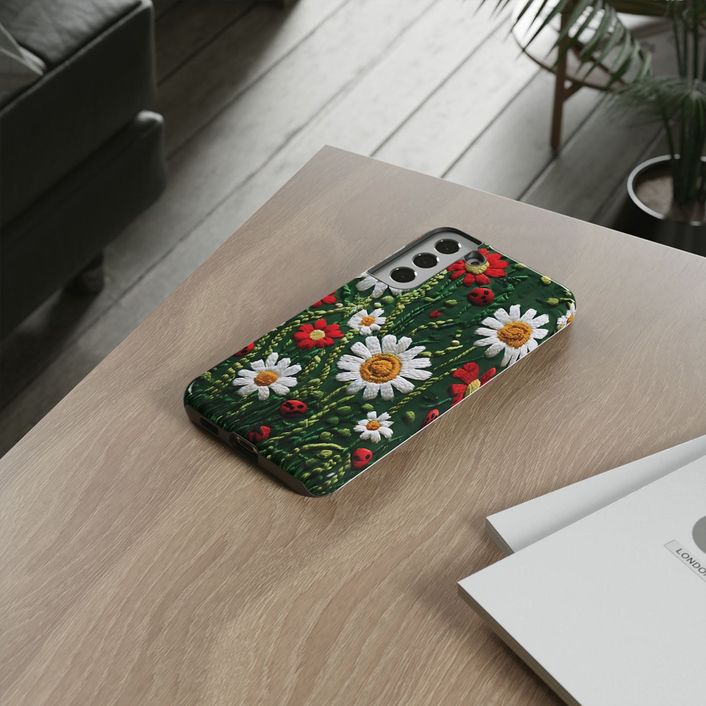 Intricate Embroidered Fabric Featuring Daisies And Ladybugs phone case design