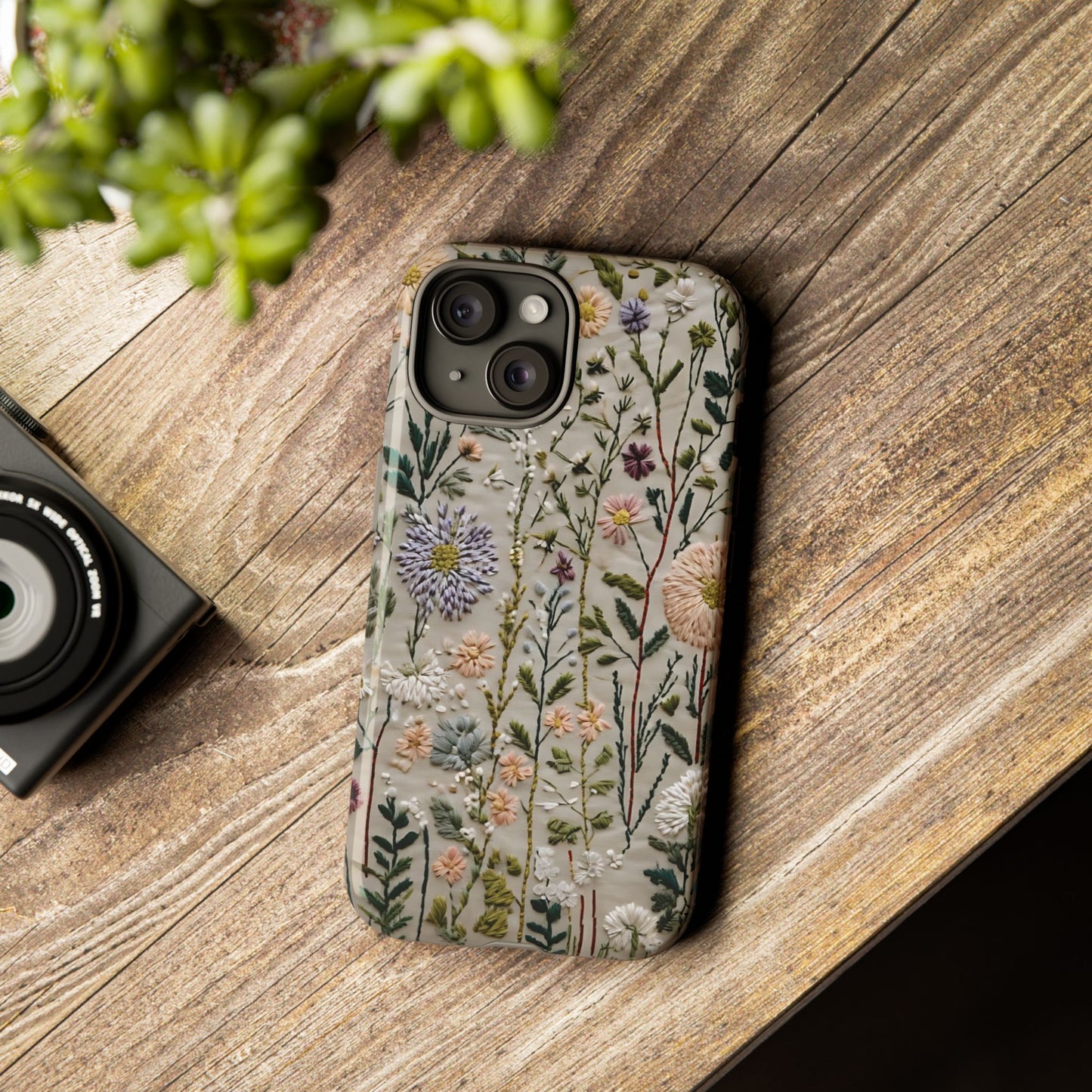 Intricate Embroidery Artwork Featuring Botanical Elements On Beige phone case design.