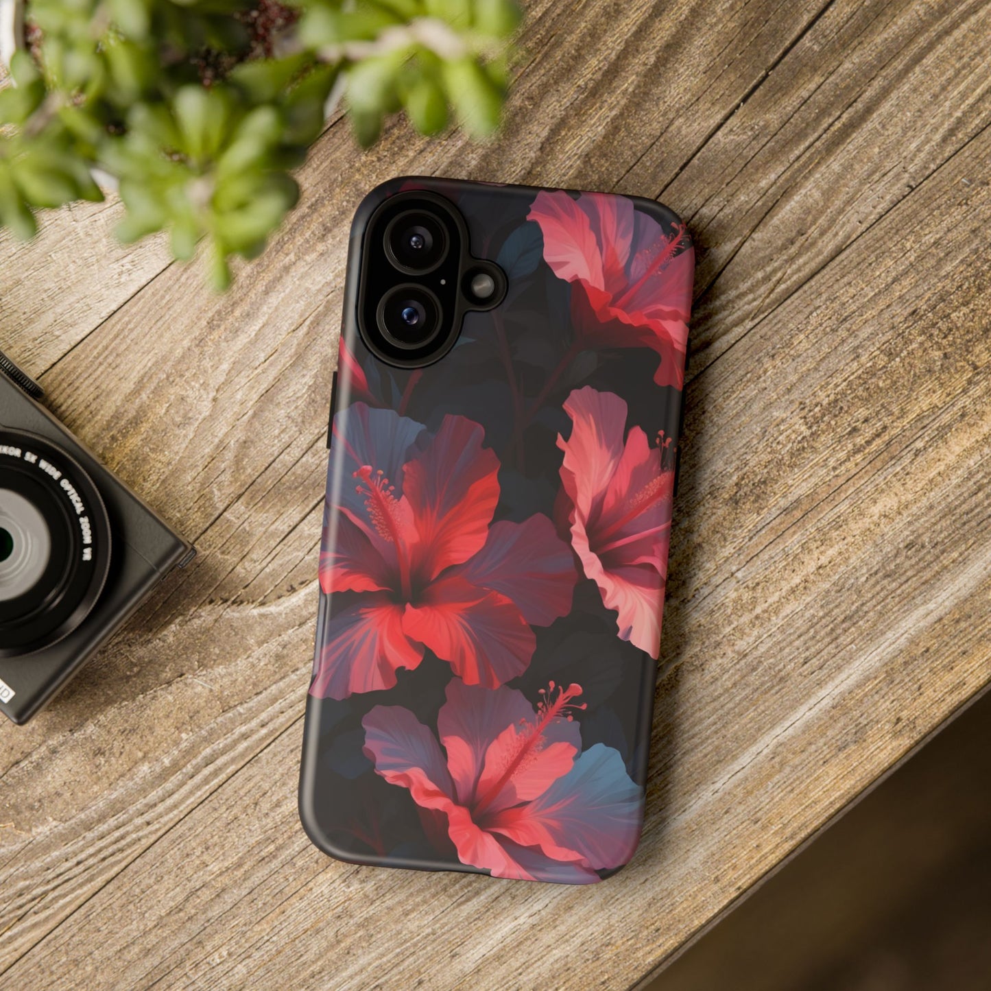Vibrant red and pink hibiscus flowers blooming against a dark background| Floral phone case design