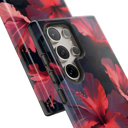 Vibrant red and pink hibiscus flowers blooming against a dark background| Floral phone case design