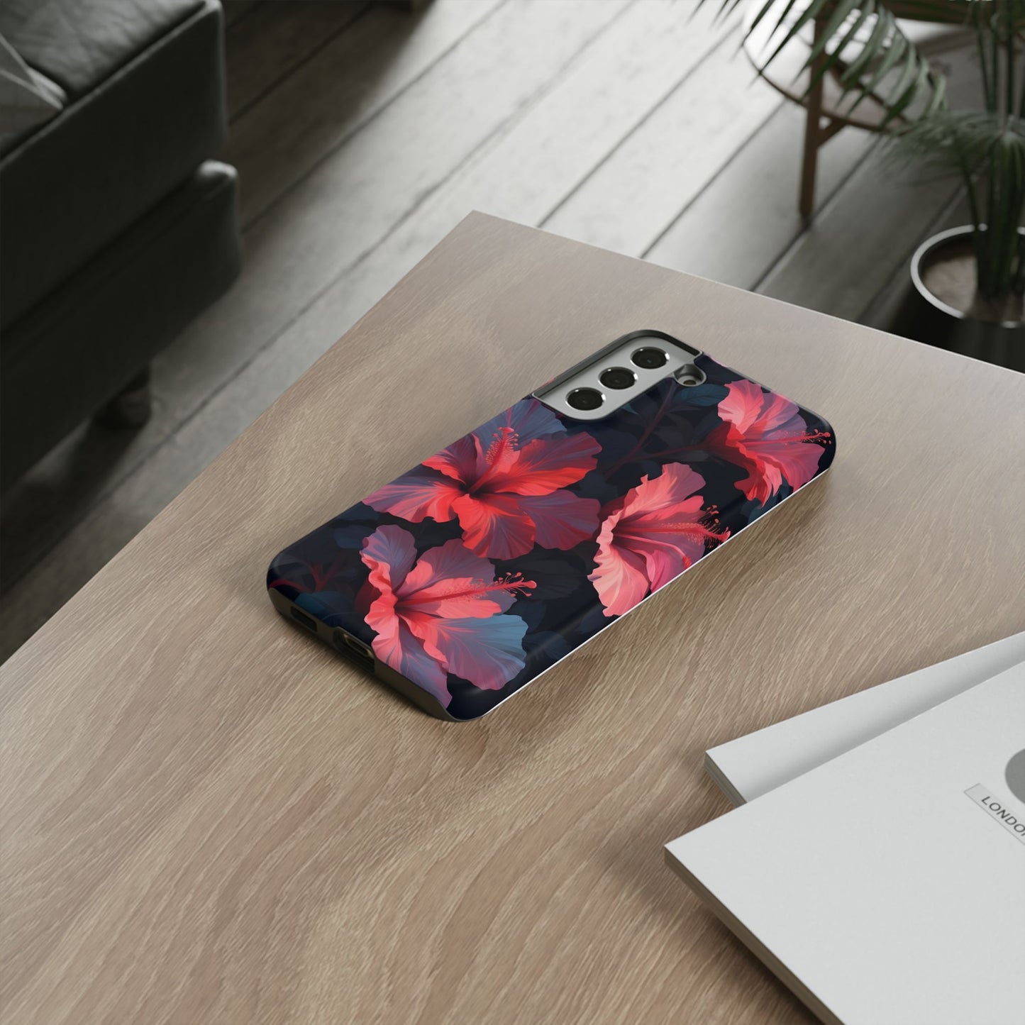 Vibrant red and pink hibiscus flowers blooming against a dark background| Floral phone case design